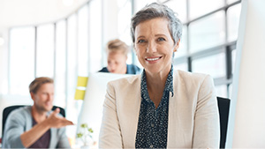 Smiling mature business woman in office